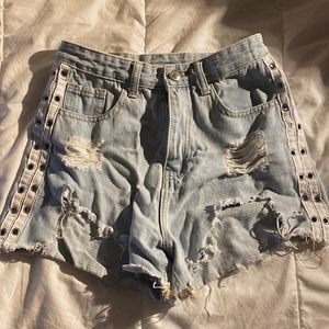 Blue denim shorts w/ ring holes on the sides! Very good condition!